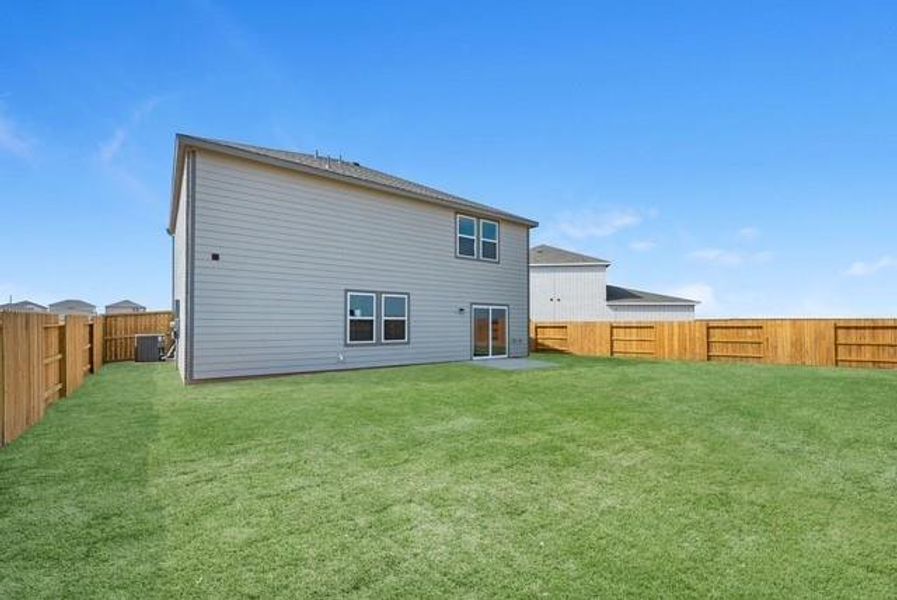 Exterior details and patio area of a home in Sunterra Lakes, Brookshire (Image 2).