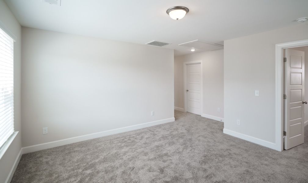 Representative unfurnished interior of a home built from the The Holland by Cothran Homes in Holly Ridge, Greenville (Image 32).