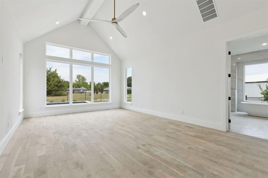 Your primary suite is tucked away with a sitting area, private patio, incredible ensuite bath, and custom closet.