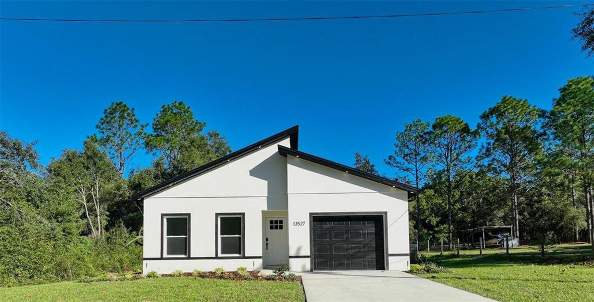 Front exterior of a new home in , Dunnellon, FL, highlighting curb appeal (Image 18).