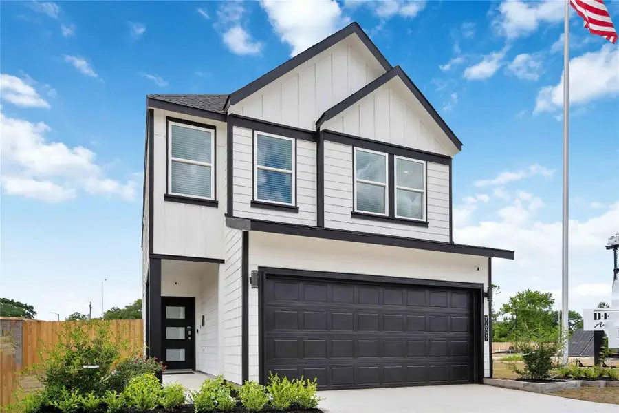 Front exterior of a new home in Alaia Crossing, Houston, TX, highlighting curb appeal (Image 1).