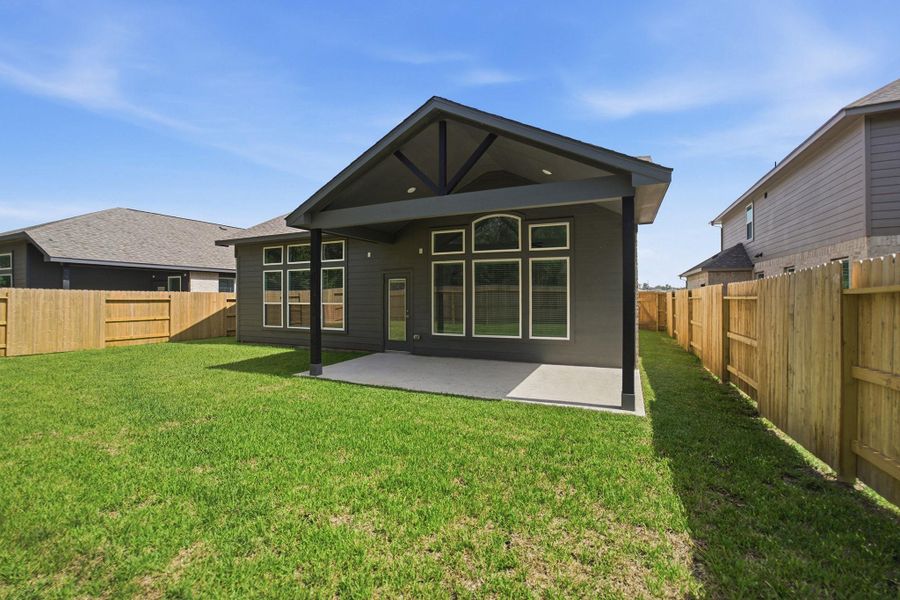 Exterior details and patio area of a home in Sundance Cove, Crosby (Image 3). Exterior details and patio area of a home in Sundance Cove, Crosby (Image 3).