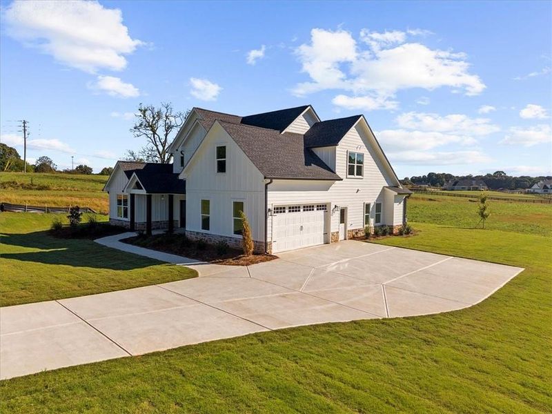 Front exterior of a new home in , Cumming, GA, highlighting curb appeal (Image 33).