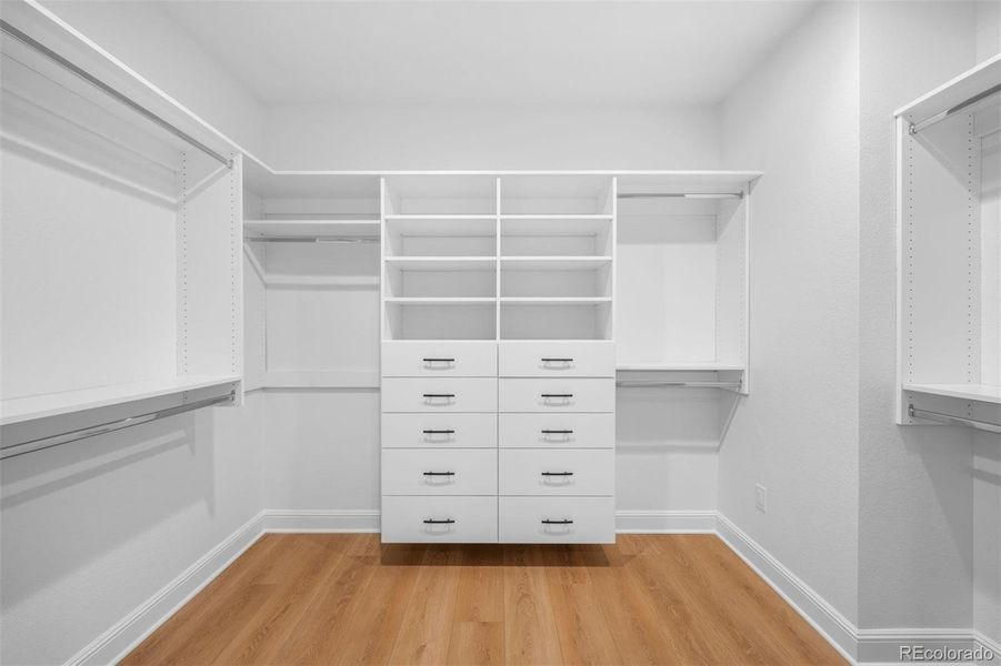 Massive primary walk-in closet with built- storage