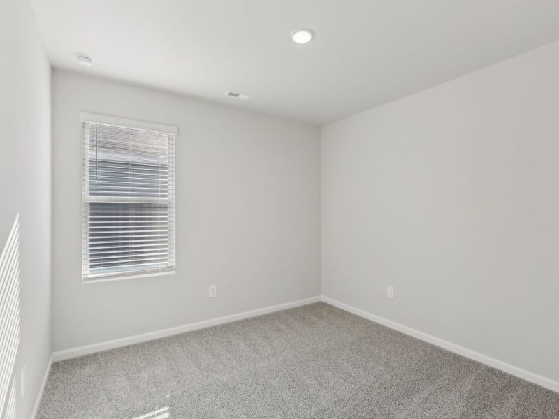 Secondary bedroom in the Dakota floorplan at 199 White Birch Lane.