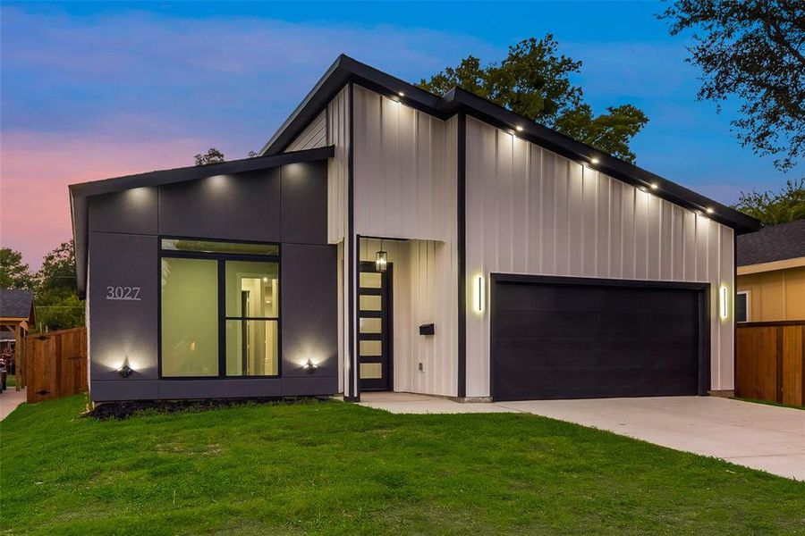 Contemporary home featuring a lawn