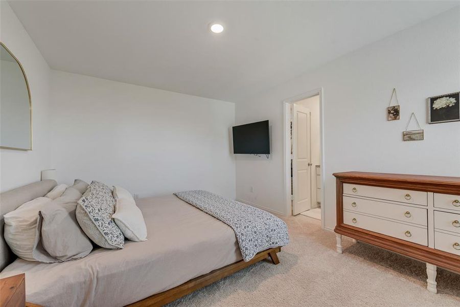Bedroom featuring light carpet and recessed lighting Bedroom featuring light carpet and recessed lighting