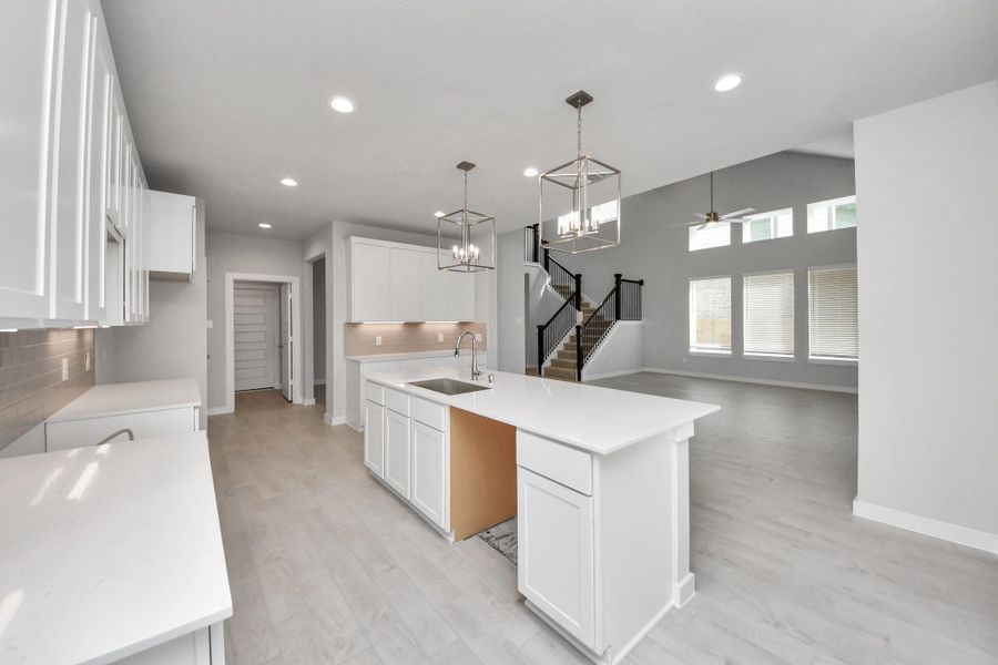 This generously spacious kitchen is a dream realized! Sample photo of completed home with similar floor plan. Actual colors and selections may vary.