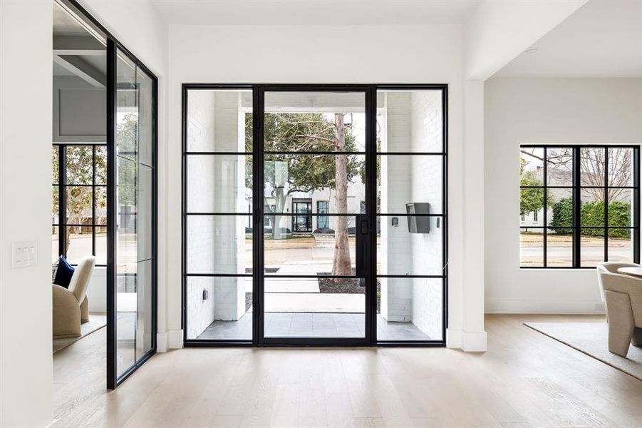 Doorway to outside with light wood-type flooring