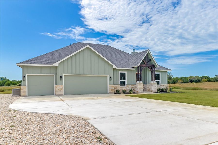 Front exterior of a new home in , Bertram, TX, highlighting curb appeal (Image 1). Front exterior of a new home in , Bertram, TX, highlighting curb appeal (Image 1).