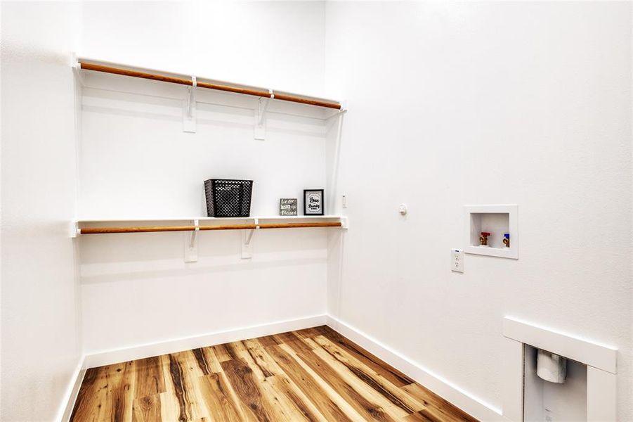 Laundry room featuring light wood finished floors, washer hookup, and hookup for a gas dryer