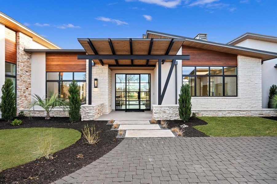 Front exterior of a new home in , Horseshoe Bay, TX, highlighting curb appeal (Image 2). Front exterior of a new home in , Horseshoe Bay, TX, highlighting curb appeal (Image 2).