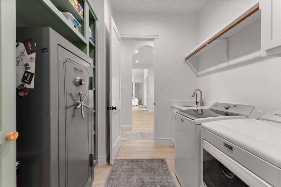 AMAZING PRIMARY CLOSET with two rooms and built in shelves and drawer OPEN TO LAUNDRY room with sink and storage. AMAZING PRIMARY CLOSET with two rooms and built in shelves and drawer OPEN TO LAUNDRY room with sink and storage.