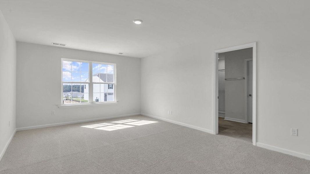 Spacious, unfurnished interior of a new home in The Preserve at Kinsley, Jamestown (Image 27). Spacious, unfurnished interior of a new home in The Preserve at Kinsley, Jamestown (Image 27).