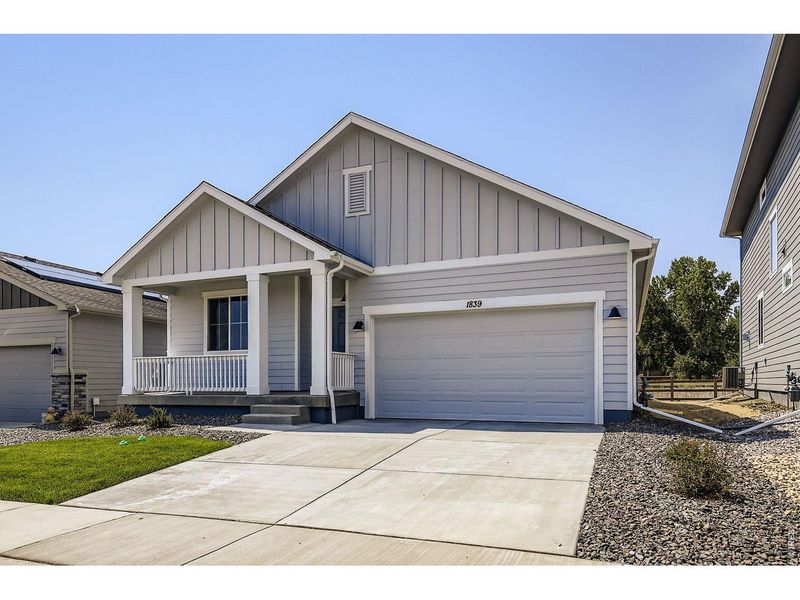 Front exterior of a new home in Trevenna, Windsor, CO, highlighting curb appeal (Image 1). Front exterior of a new home in Trevenna, Windsor, CO, highlighting curb appeal (Image 1).