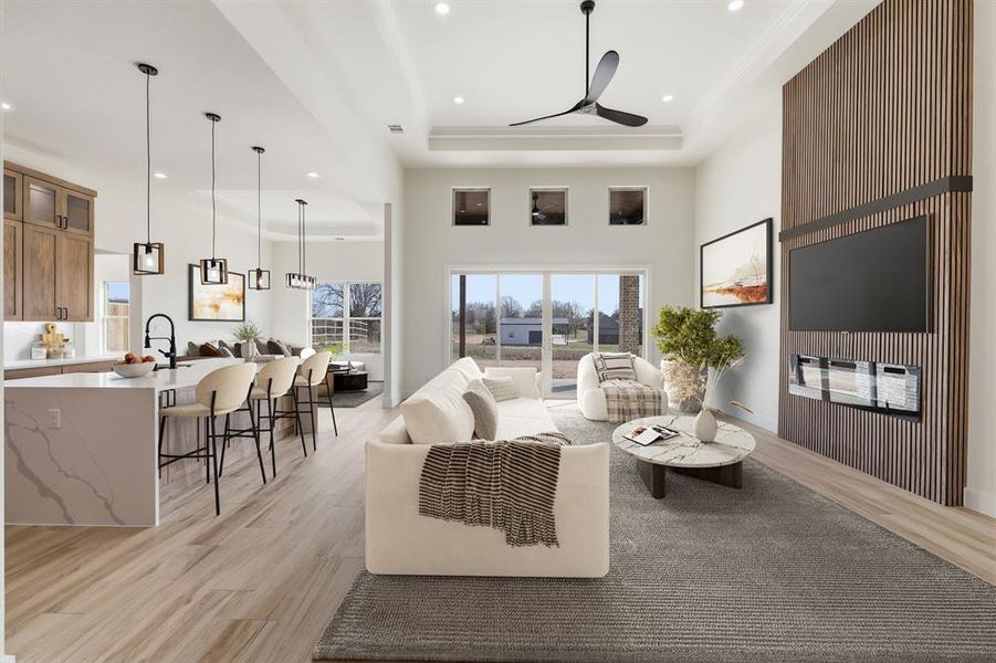 Virtually staged open living room and kitchen. Virtually staged open living room and kitchen.