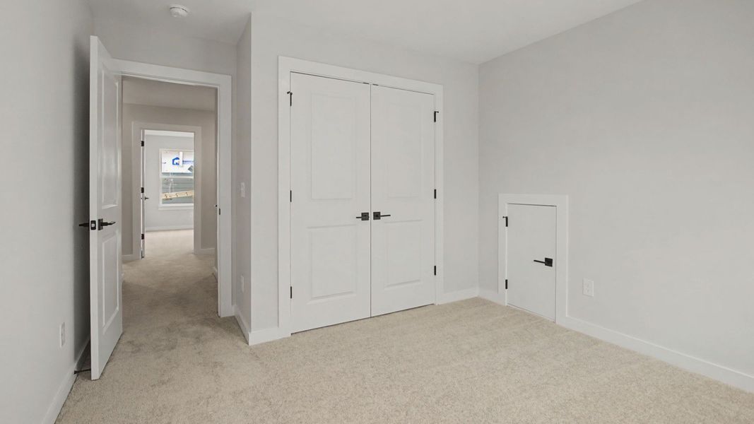 Second floor bedroom with closet and storage area