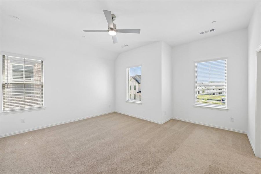 A light filled owner's suite that offers high ceilings, tons of natural light, his & hers walk in closets....our Hansen floor plan has it all!
