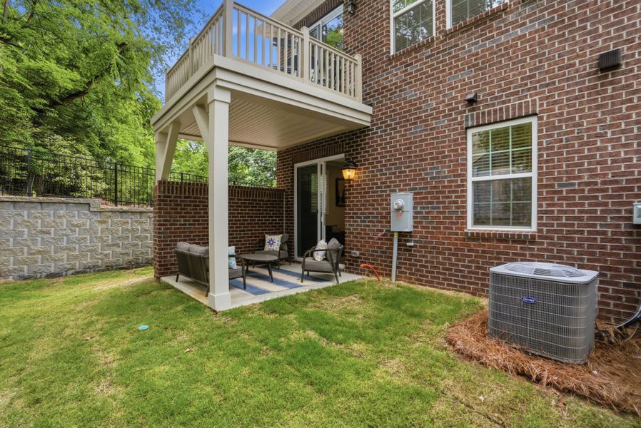 Exterior details and patio area of a home in The Townes at Wade Ardrey, Charlotte (Image 26). Exterior details and patio area of a home in The Townes at Wade Ardrey, Charlotte (Image 26).