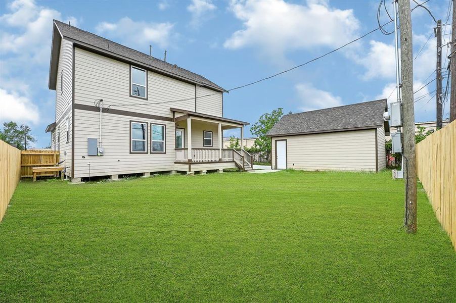 view of backyard with garage