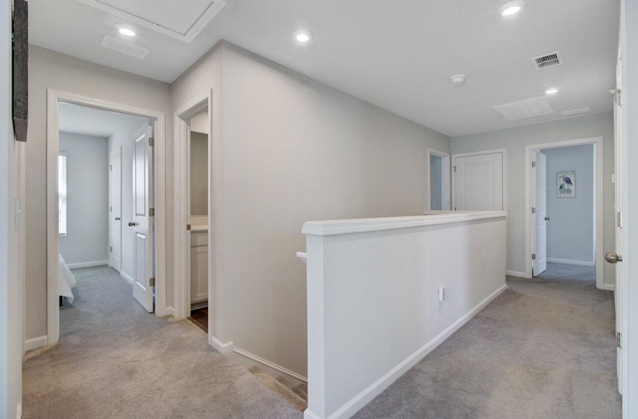 Spacious, unfurnished interior of a new home in Sanctuary Cove at Cane Bay, Summerville (Image 21).