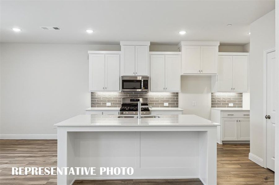 The spacious island is the hub of your new kitchen and the perfect place for friends and family to gather round! REPRESENTATIVE PHOTO The spacious island is the hub of your new kitchen and the perfect place for friends and family to gather round! REPRESENTATIVE PHOTO