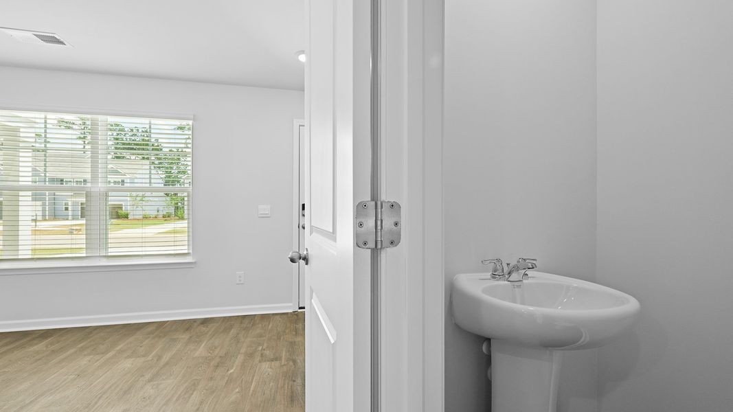 Representative furnished interior of a home built from the MURRAY TH by D.R. Horton in Pine Hills Townhomes at Cane Bay, Summerville (Image 9).