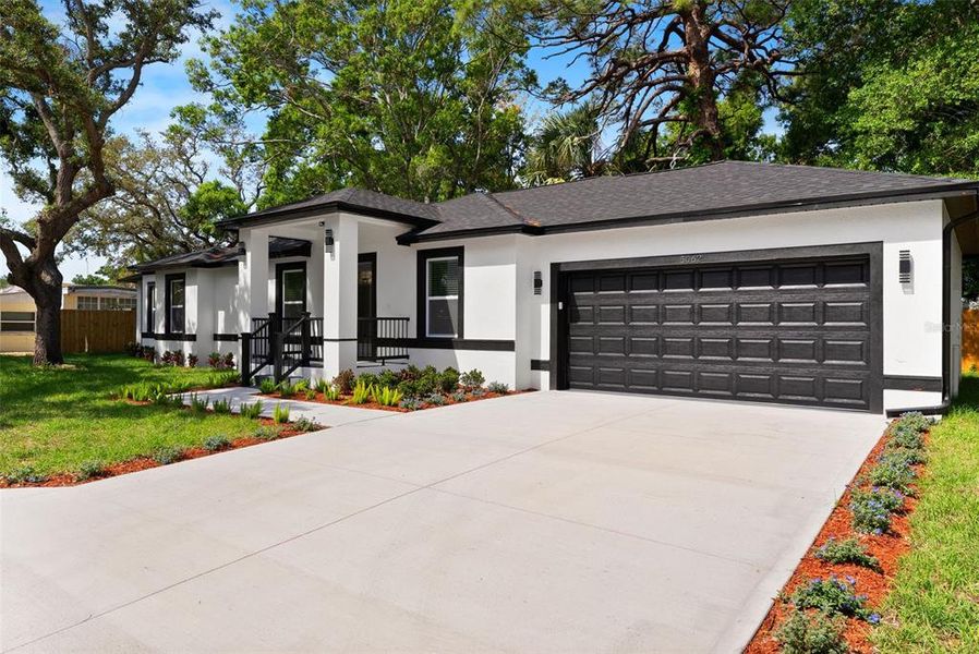 Front exterior of a new home in , St. Petersburg, FL, highlighting curb appeal (Image 25).