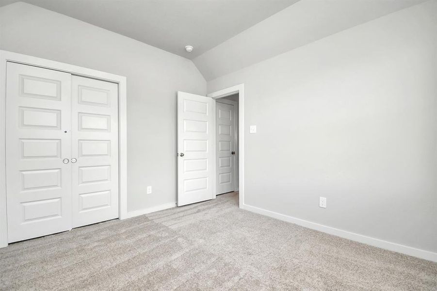 Generously sized secondary bedrooms, complete with spacious closets and soft, inviting carpeting.