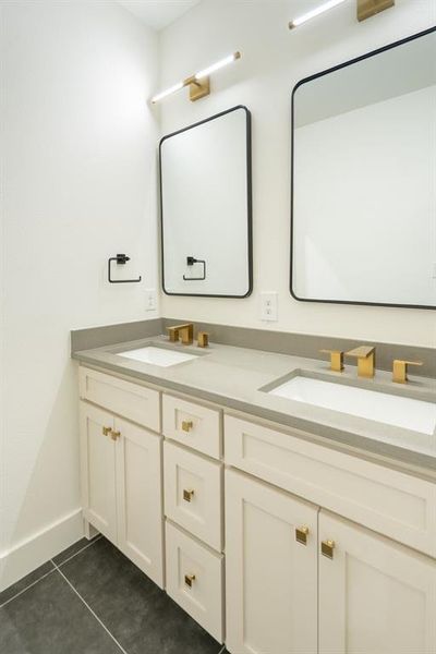 Bathroom featuring vanity and tile patterned flooring