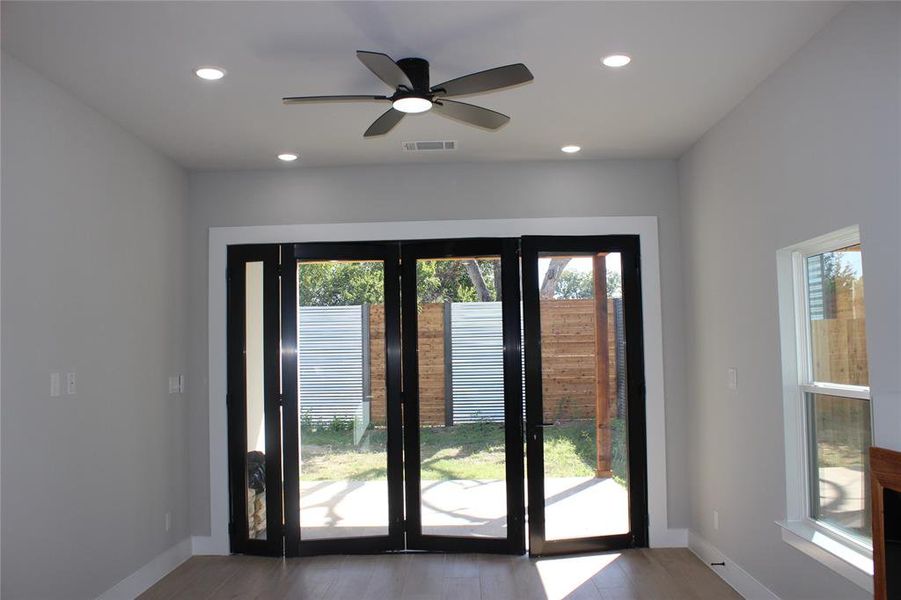 Entryway with hardwood / wood-style floors and ceiling fan