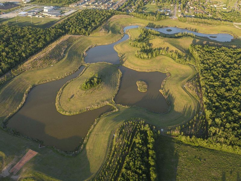 Scenic community lakes and green space located just behind the home, offering peaceful views and access to nearby walking trails.