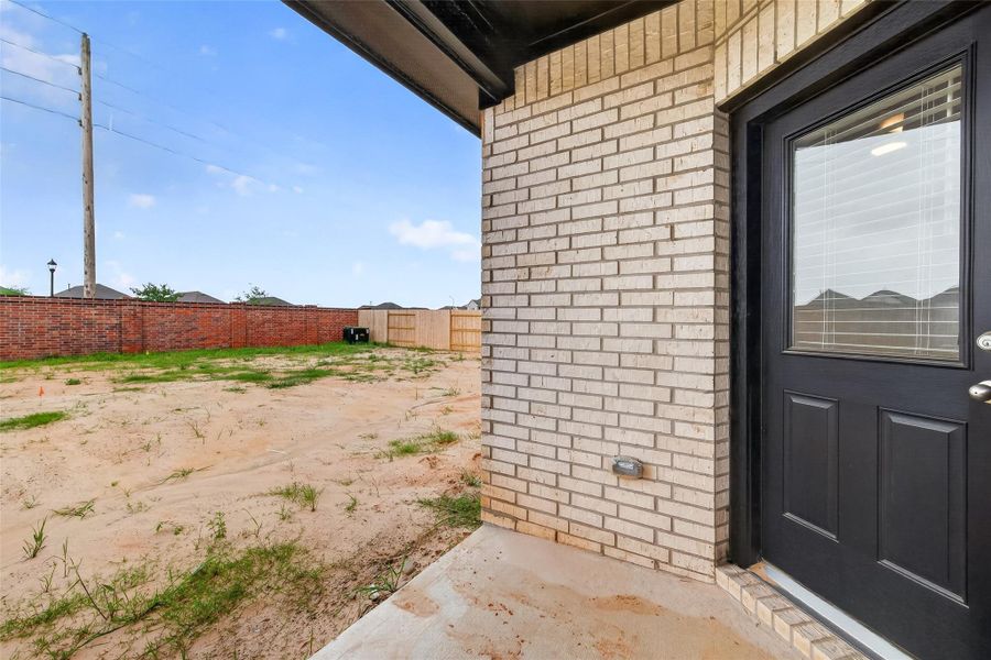 Exterior details and patio area of a home in Sunterra, Katy (Image 29).