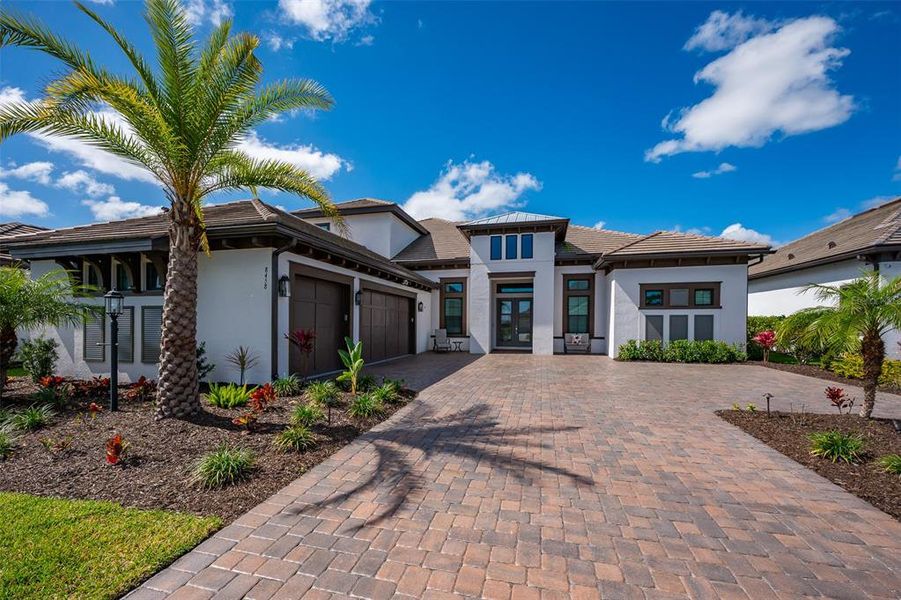 Front exterior of a new home in , Sarasota, FL, highlighting curb appeal (Image 21).