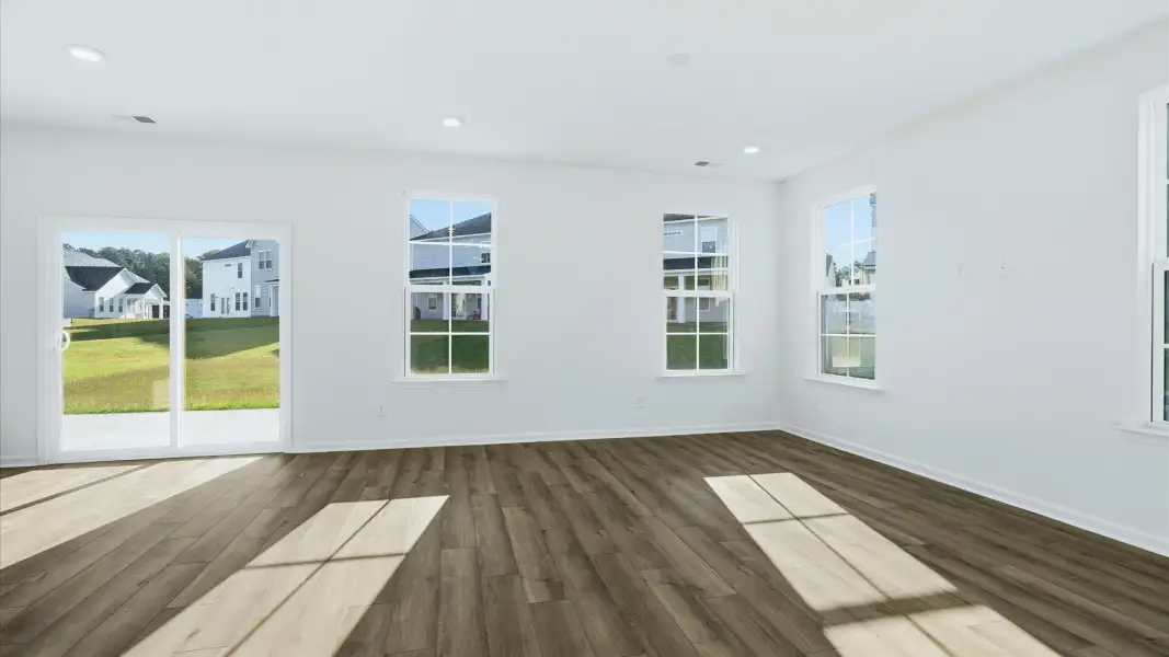 Spacious Pritchard living room with sliding glass door for easy outdoor access