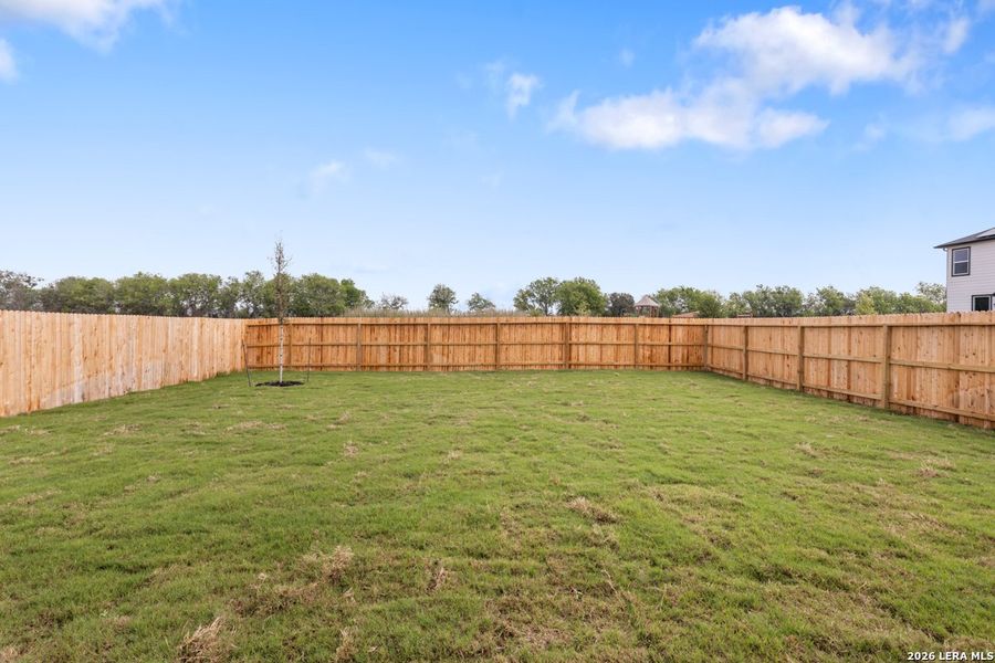 Exterior details and patio area of a home in Woodside Farms, Seguin (Image 18).