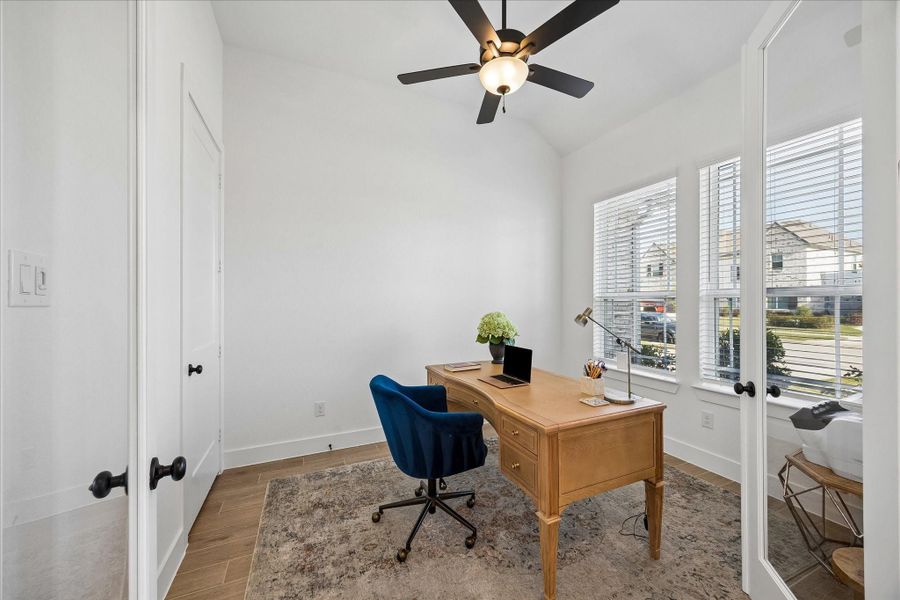 Bright front study anchored by a vaulted ceiling and corner windows that pull in natural light throughout the day. Positioned just off the entry, offering a quiet and functional workspace with a clean, modern feel. Bright front study anchored by a vaulted ceiling and corner windows that pull in natural light throughout the day. Positioned just off the entry, offering a quiet and functional workspace with a clean, modern feel.