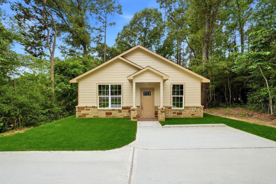 Front exterior of a new home in , Coldspring, TX, highlighting curb appeal (Image 2). Front exterior of a new home in , Coldspring, TX, highlighting curb appeal (Image 2).