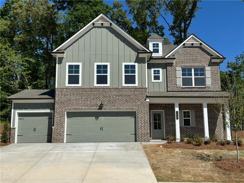 Front exterior of a new home in Rosewood Lake Preserve, Hoschton, GA, highlighting curb appeal (Image 22).