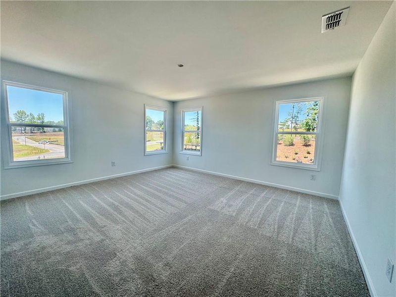 Spacious, unfurnished interior of a new home in Eastlyn Crossing, Flowery Branch (Image 21).