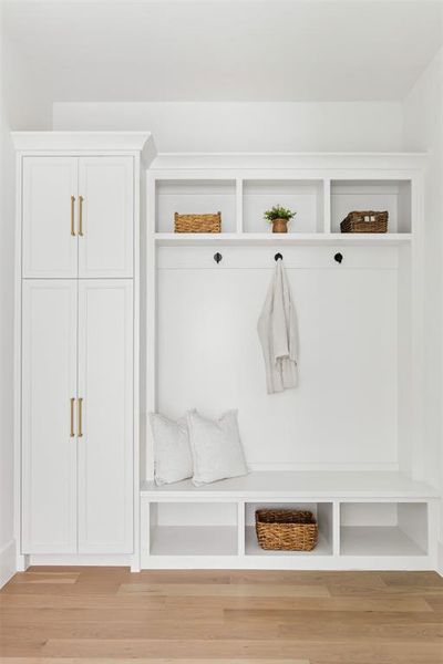 Mudroom with light wood-style flooring Mudroom with light wood-style flooring