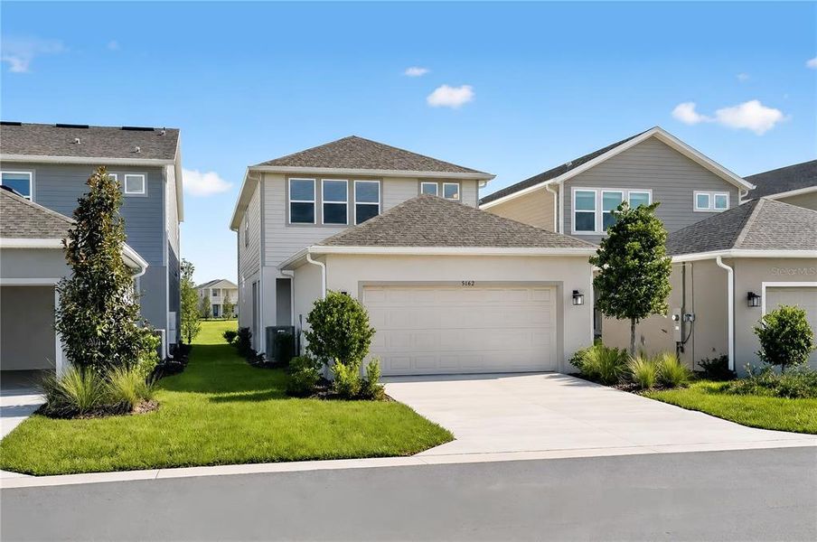 Front exterior of a new home in Center Lake Ranch Community Group Page, St. Cloud, FL, highlighting curb appeal (Image 24).