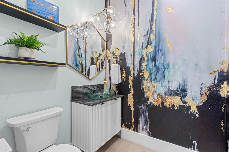 Bathroom featuring vanity and a chandelier