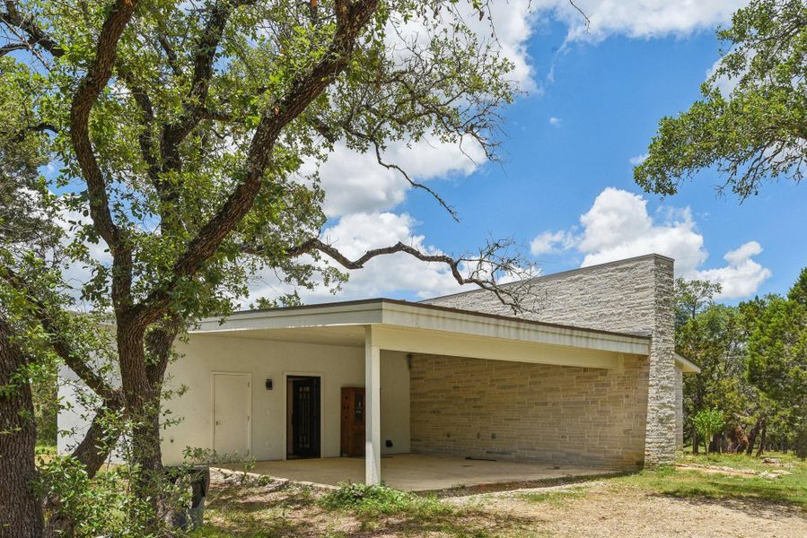 Attached carport with entrance into kitchen