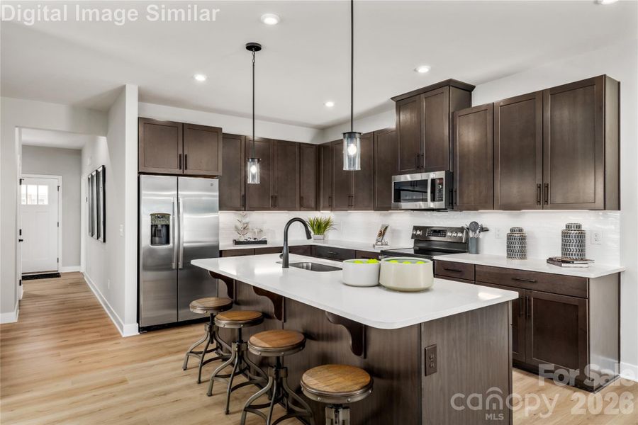 Enjoy Seamless Cooking And Conversation In This Beautifully Open Layout - Never Miss A Beat Preparing Your Favorite Meals.