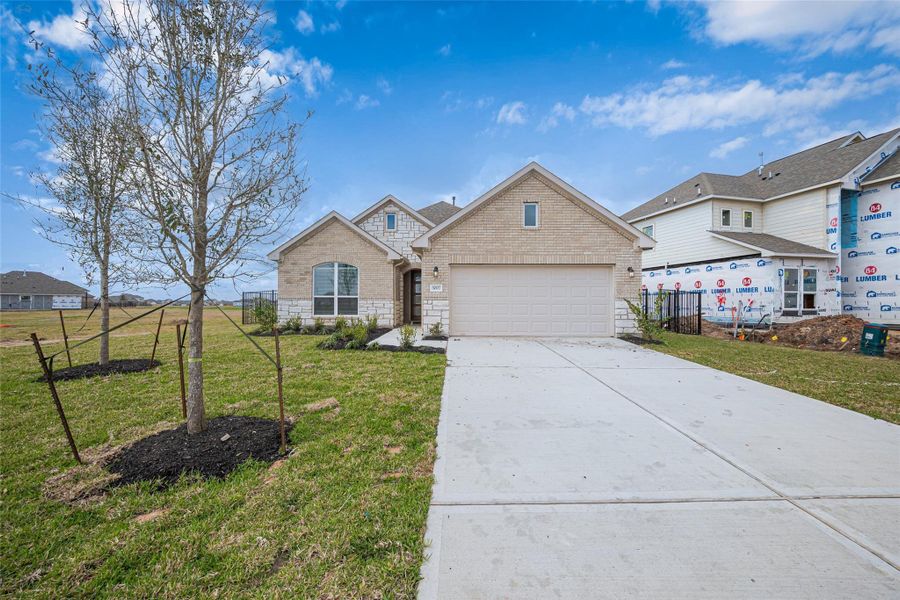 Front exterior of a new home in Lago Mar, Texas City, TX, highlighting curb appeal (Image 20). Front exterior of a new home in Lago Mar, Texas City, TX, highlighting curb appeal (Image 20).