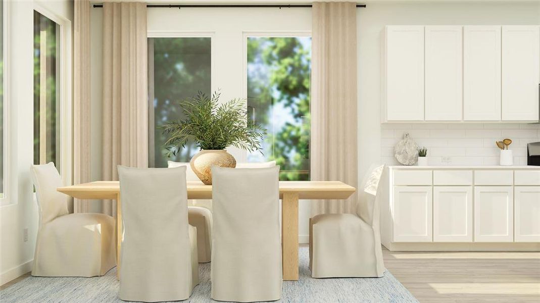 Dining area with light hardwood / wood-style floors