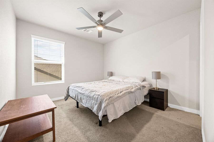 Furnished interior view inside a new home in Sunterra, Katy (Image 4).