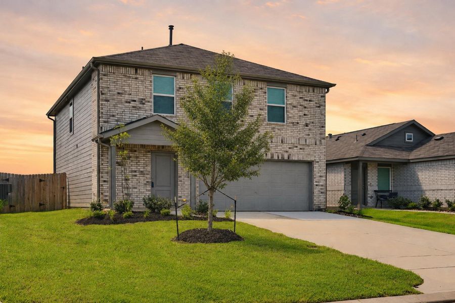 Front exterior of a new home in Meadow Park, Conroe, TX, highlighting curb appeal (Image 1). Front exterior of a new home in Meadow Park, Conroe, TX, highlighting curb appeal (Image 1).