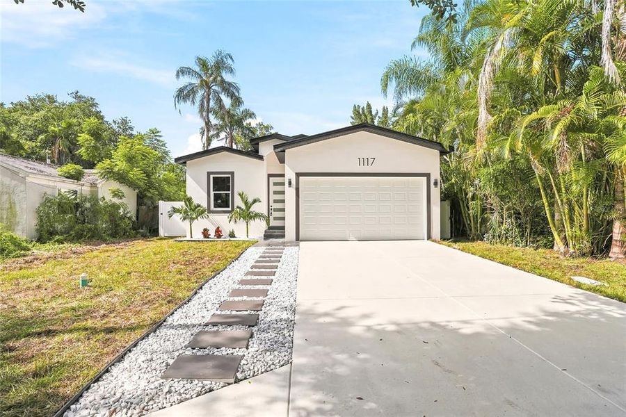 Front exterior of a new home in , Largo, FL, highlighting curb appeal (Image 20). Front exterior of a new home in , Largo, FL, highlighting curb appeal (Image 20).